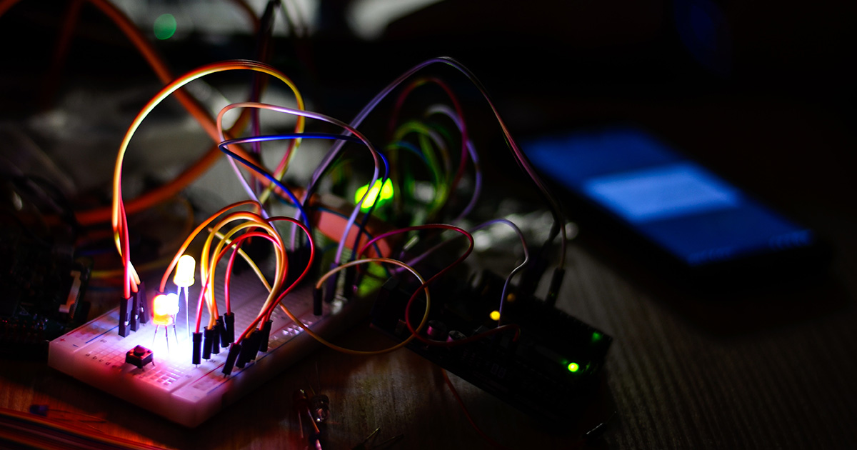 Cables and a breadboard. Photo by Victor Aznabaev on Unsplash.